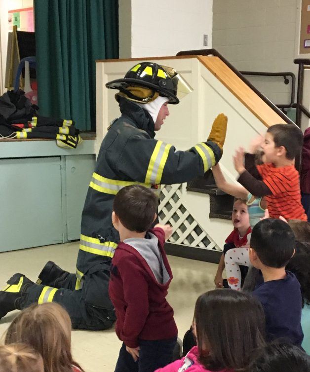SAFE Firefighter with kid