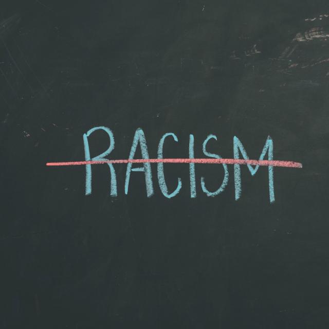 chalkboard-sign-letters-racism-illustration-id640899990