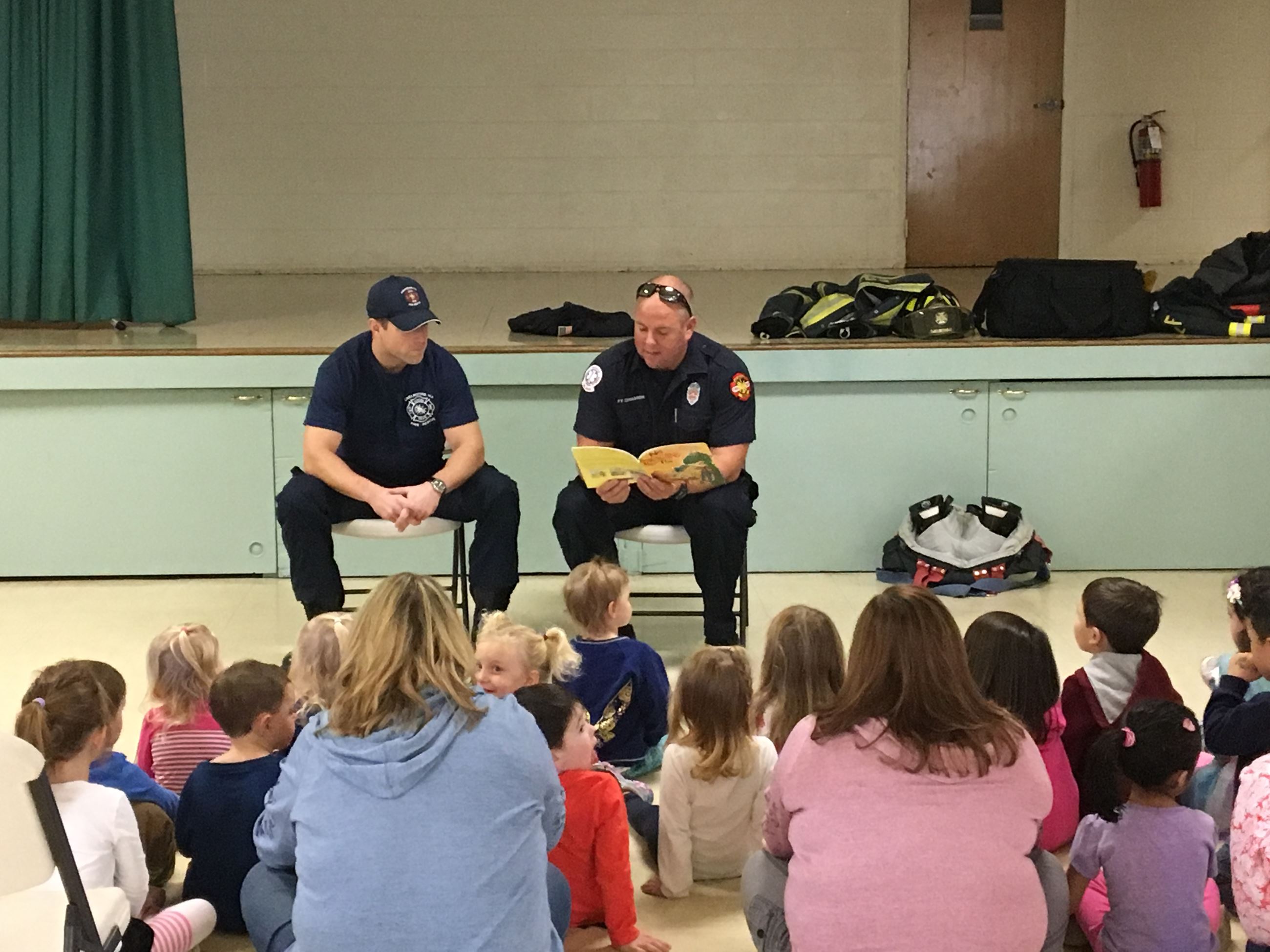 Firefighters reading to kids